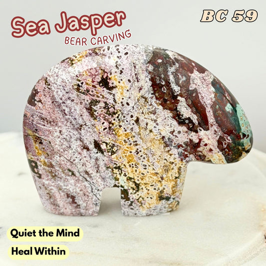 A polished sea Jasper bear carving stone with marbled pink, white, gold, and dark brown patterns, displayed on a light surface with text overlays.