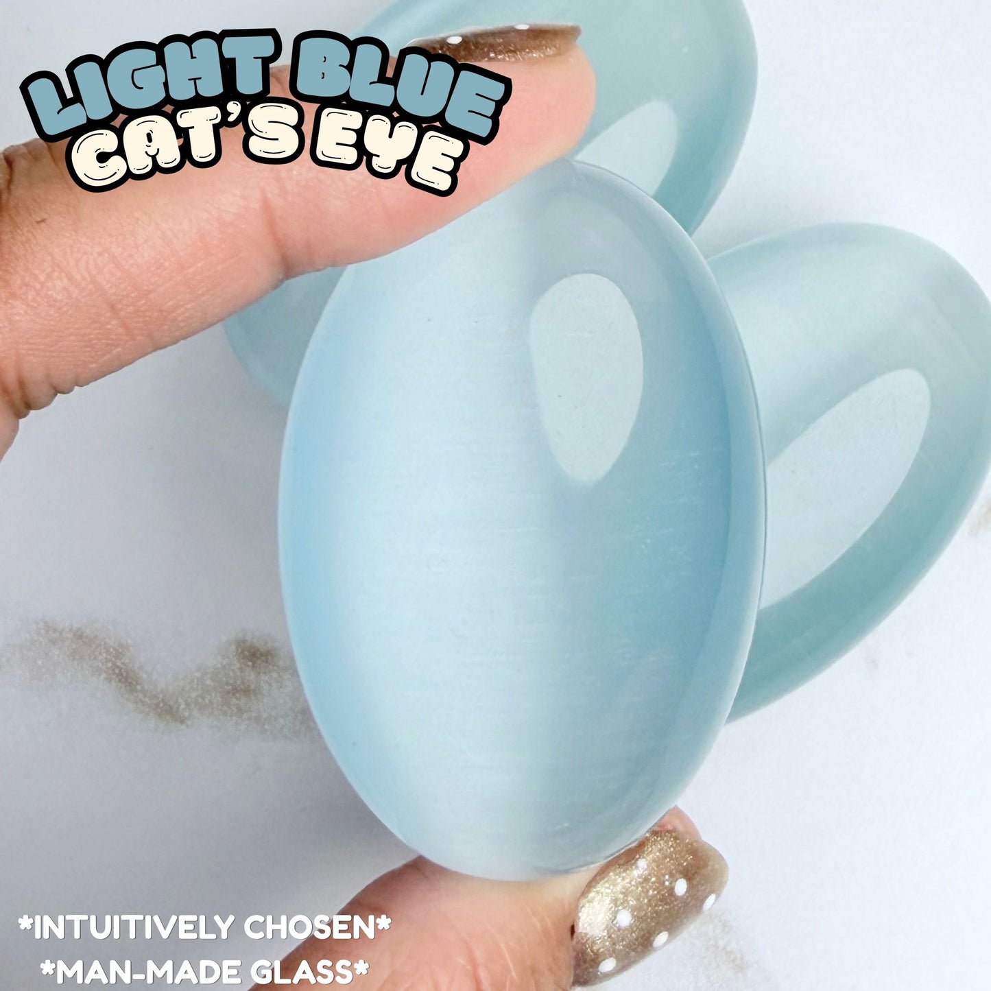 Light Blue Cat's Eye Palm Stone | Synthetic