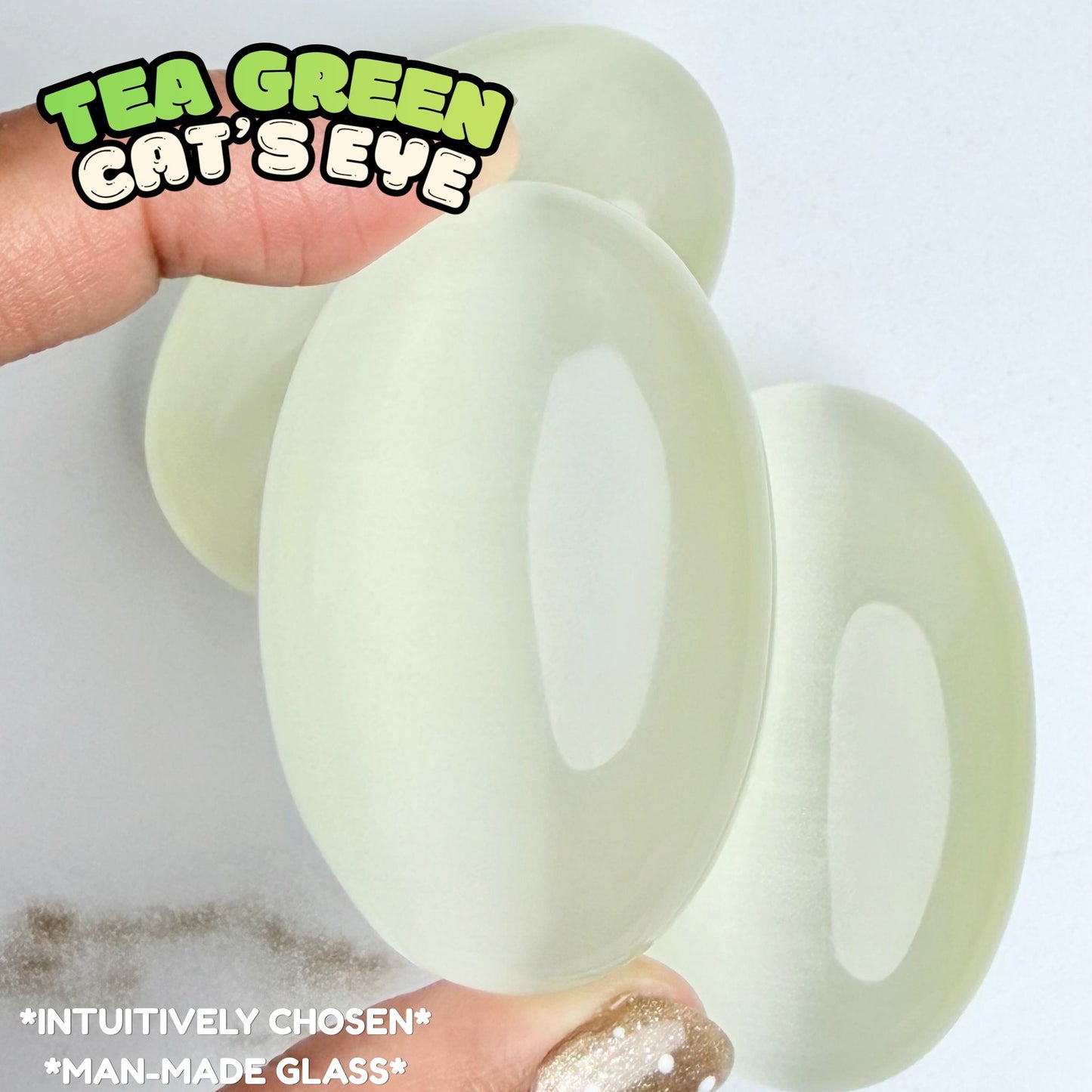 Tea Green Cat's Eye Palm Stone | Synthetic