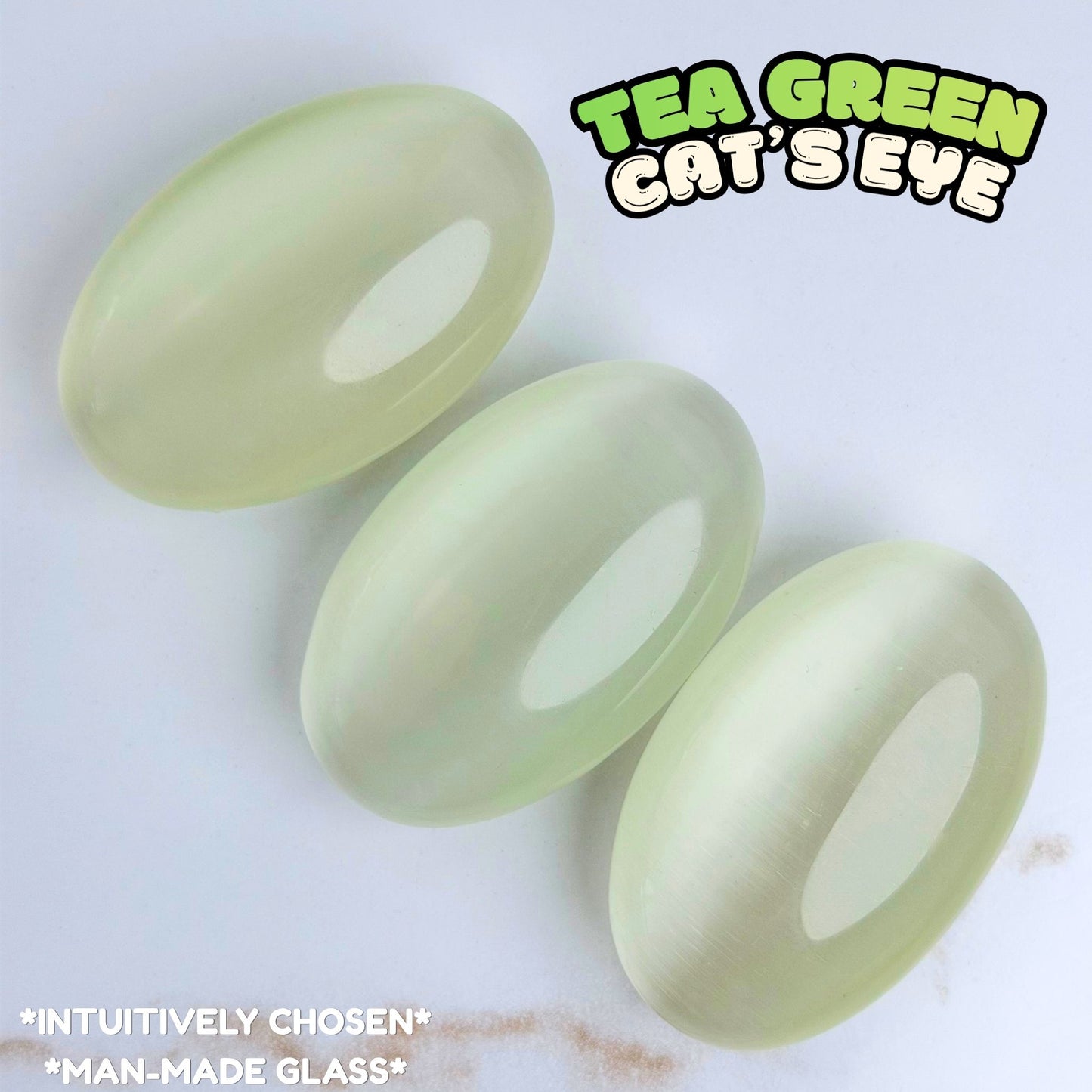 Tea Green Cat's Eye Palm Stone | Synthetic
